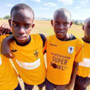 Julian Chenery has helped to get old Fakenham Town FC shirts across Africa to support children - This photo was taking at the Talents Academy in Uganda