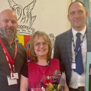 Gavin Green (right), headteacher of Fakenham Academy and Kevin Lamb, Area Manager saying goodbye and good luck to Paula Main