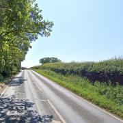 The A1067 Fakenham Road was closed at Sparham Hill following a crash