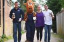 Paul Sandford, (L) landlord of the Railway Tavern in Dereham is organising a pub walk to raise money for military PTSD. Also pictured are (from left) Biscuit the Dereham Carnival mascot, Elaine Winterbone and Bruno Hipolito. Picture: Ian Burt