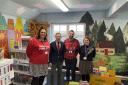 Duncan Baker (second from left) with staff at Astley Primary School in Melton Constable at the opening of its new library