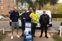 David Holliday (centre, yellow top), co-owner of Moon Gazer Ale in Hindringham, between Fakenham and Wells, at the start of his 186-mile fundraising challenge