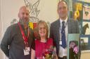 Gavin Green (right), headteacher of Fakenham Academy and Kevin Lamb, Area Manager saying goodbye and good luck to Paula Main