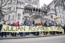 Supporters outside the Royal Courts of Justice in London, during the two-day hearing in the extradition case of WikiLeaks founder Julian Assange (Jonathan Brady/PA)