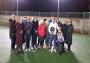 James Buddell (centre, with shield) and volunteers at North Elmham tennis club after he was awarded Norfolk LTA Volunteer Award