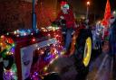 David and Phoebe Vardigans, along with Nigel Curson took to the streets in their festively decorated tractors for the third time this week to hand out cones of sweets to children across Fakenham
