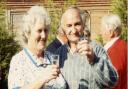 Norfolk agricultural industry figure Jim Davidson has died aged 93. Here he is pictured with his wife Isabel raising a glass at a garden party