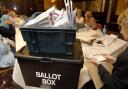 Votes being counted at a local government election. An increased number of people are expected to vote by post at the local government elections in May. Picture: PA