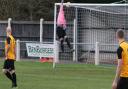 Sam Garner lobs the Long Melford keeper to score in Fakenham Town's weekend win. Picture: TONY MILES