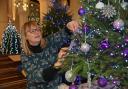 Setting up at the Fakenham Christmas Tree Festival in 2022. Penny Thornton from the Epilepsy Society