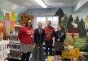 Duncan Baker (second from left) with staff at Astley Primary School in Melton Constable at the opening of its new library