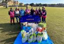 Participants and volunteers at Holkham Parkrun with donations collected for local food banks at their Food Bank Run on Saturday,  February 11