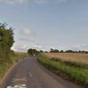 An air ambulance has been called following a crash involving a motorbike and car on the B1146 Dereham Road in Colkirk