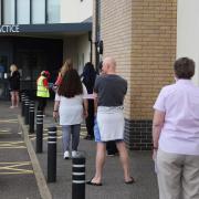 Patients queue at the Fakenham Medical Practice (photo taken in 2021)