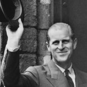 The Duke of Edinburgh greets the crowds on arrival at the Guildhall of St. George, King's Lynn. Dated 23 October 1959