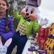 Lottie Mansel, 9, receiving some Easter eggs at Swanton Morley's Robertson Barracks where Tesco brought some cheer to the children of military families.
