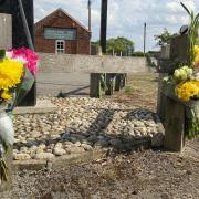 Floral tributes were left in North Elmham, near Dereham, following the death of a biker in his 20s