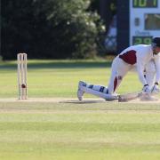 Fakenham's Chad Bowes, reverse sweeping, on his way to a century. Picture: RONNIE HEYHOE