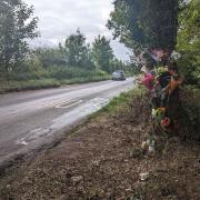 Flowers, candles and cards were left by a tree on the B1110 in North Elmham following the crash
