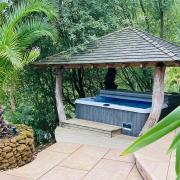 The covered hot tub at Wispy Meadows\' Boat House