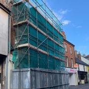 The building at 9 Norwich Street, Fakenham, surrounded by scaffolding