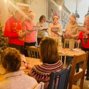 The Crown in Fakenham welcomed 20 people for a free Christmas meal, prior to carol singing