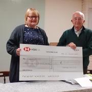 The cheque was presented to Clarissa Belson, manager of First Focus by Fakenham Auto Club chairman Brian Monks