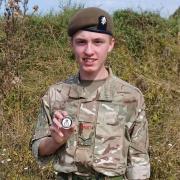 Lance Corporal Tyler Barker with his coin