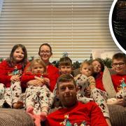 James Brierley with his partner Josie Floor and their seven children at their home in Little Snoring. Last year’s light-up (inset) featured 200 metres of lights