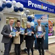 Paul Waters managing director at Premier Travel, two members of staff of Fakenham's Premier Travel and Peter Ryan from Celebrity Cruises at the shops opening