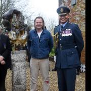 From left, former West Raynham station commander, Ed Durham; Ken Delve, chair of Trustees Veterans Central; sculptor, Drew Edwards; and RAF Marham station commander, group captain Fred Wigglesworth; with the sculpture at the West Raynham SHQ