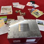 Fakenham parish church has buried a time capsule complete with chocolate moulds and a cross from the Holy Land