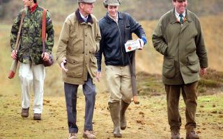 Prince Philip attending a shooting competition at Sandringham.